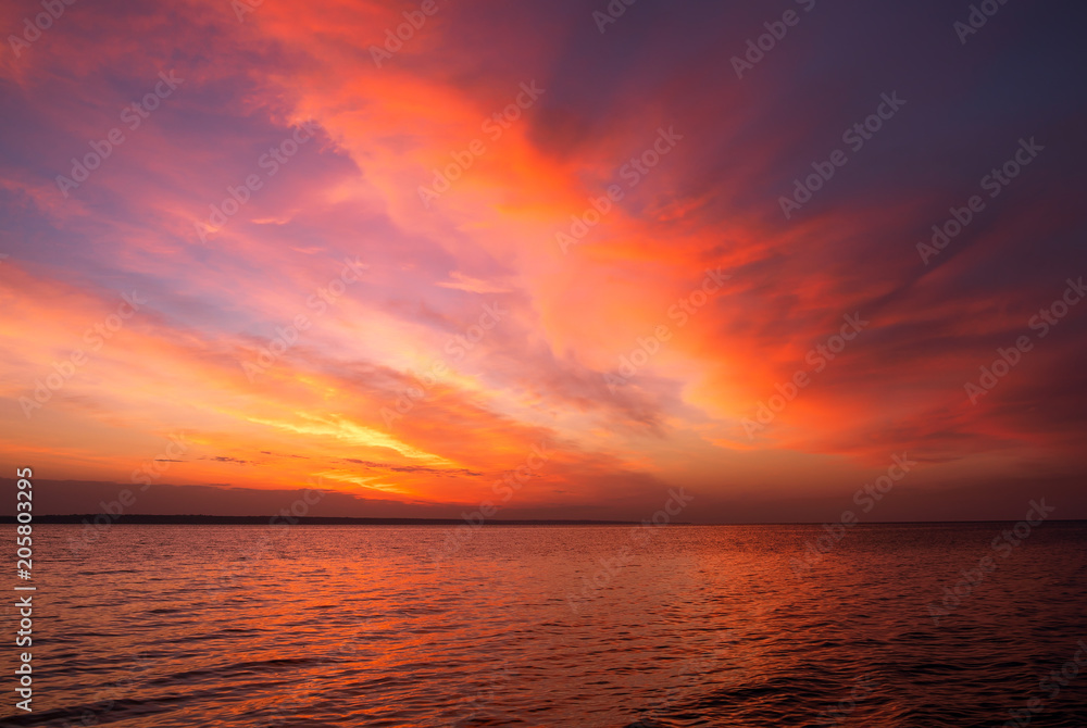 Magic orange sunset over sea. Sunrise over Beach