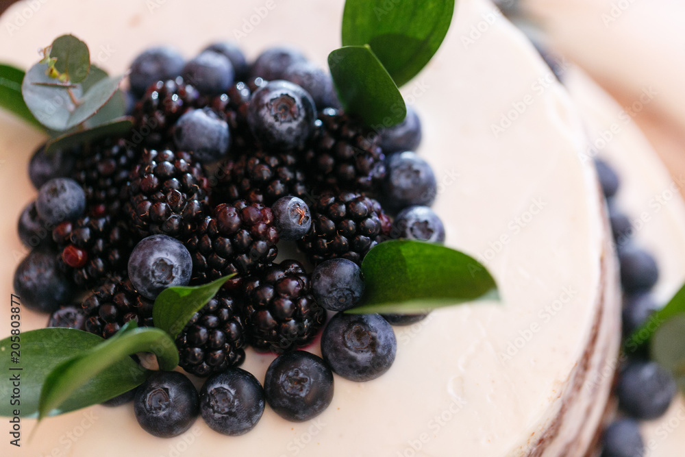 Wedding or birthday cake with berries. Sweet pie on banquet in restaurant. Wedding or birthday cake with berries. Sweet pie on banquet in restaurant.