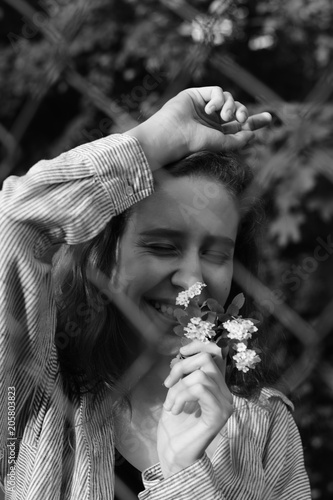 Portrait of a beautiful young girl. Joyful emotions. Black and white photo. photo