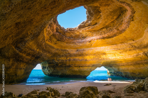 Canvas Print Carvoeiro, Portugal - June, 10, 2015 - Tourists enjoy a beautiful day to know the Benagil Cave in Algarve, one of the most wonderful caves in the world