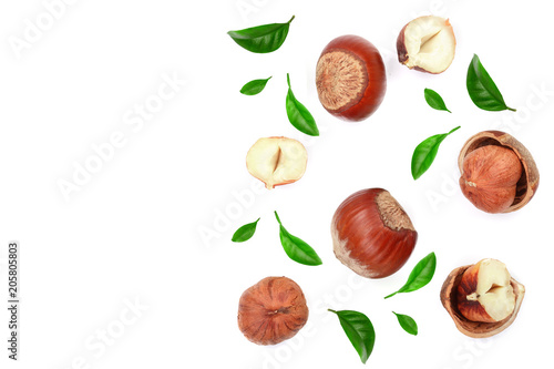 Fototapeta Naklejka Na Ścianę i Meble -  Hazelnuts with leaves with copy space for your text isolated on white background. Top view. Flat lay