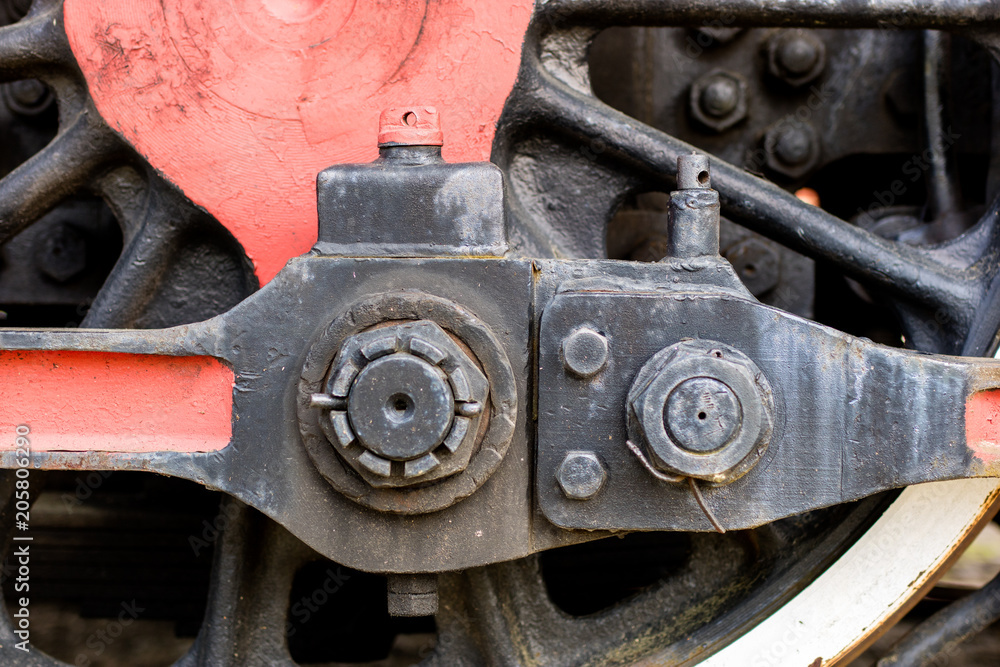 Chassis of the old train. Steel heavy wheels of a steam locomotive.