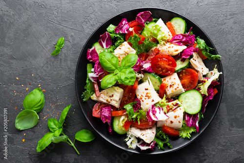 Salad with chicken meat. Fresh vegetable salad with chicken breast. Meat salad with chicken fillet and fresh vegetables on plate