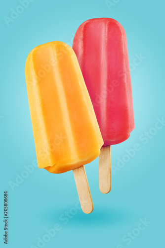 Popsicles on blue background photo