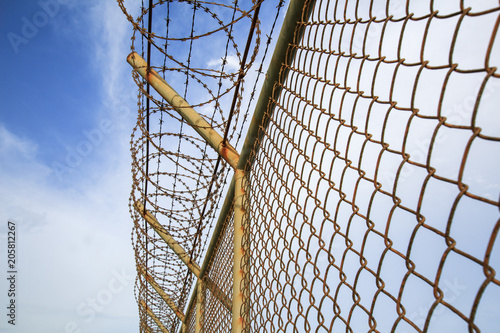 wire mesh steel with green grass background in Phuket Thailand