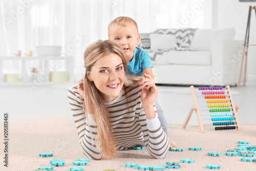 Happy mother and toddler so...