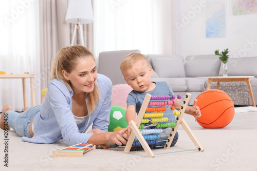 Baby and mother playing wit...