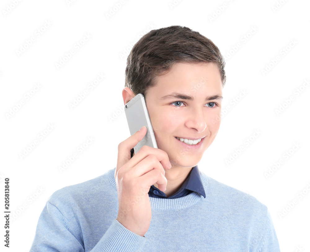 Stylish teenager talking on mobile phone against white background Stylish teenager talking on mobile phone against white background