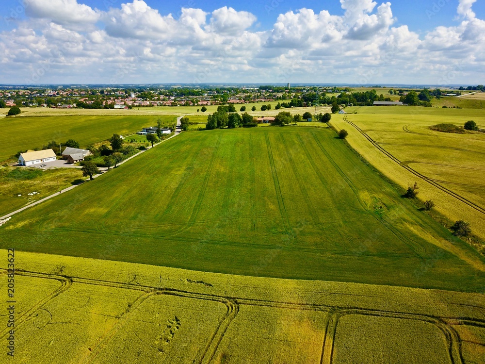 Fototapeta premium Aerial view over farming field in Sweden during summer