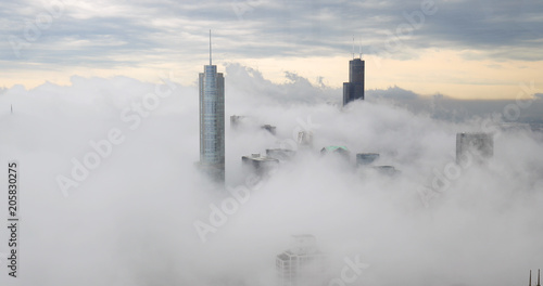 Chicago downtown buildings skyline thick fog cloud photo