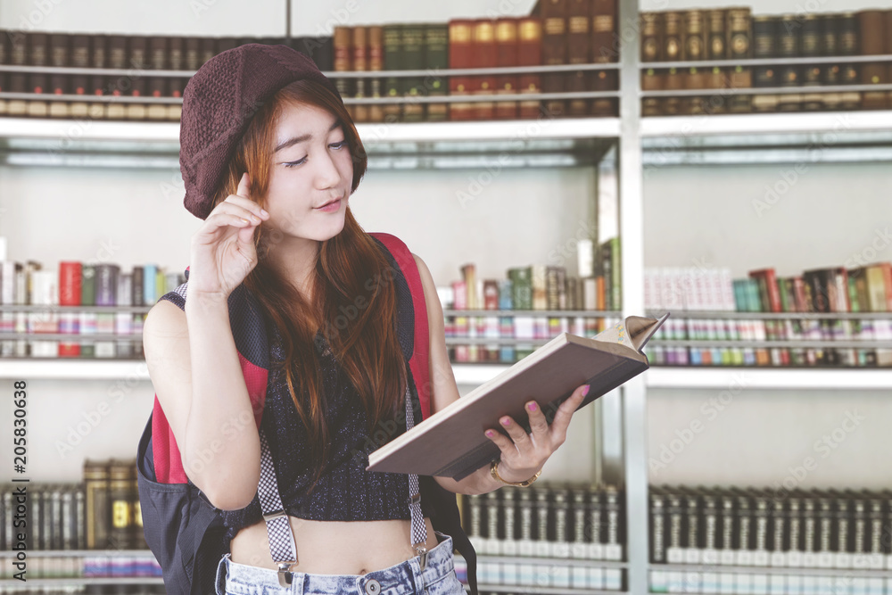Fototapeta premium Asian student learning in library
