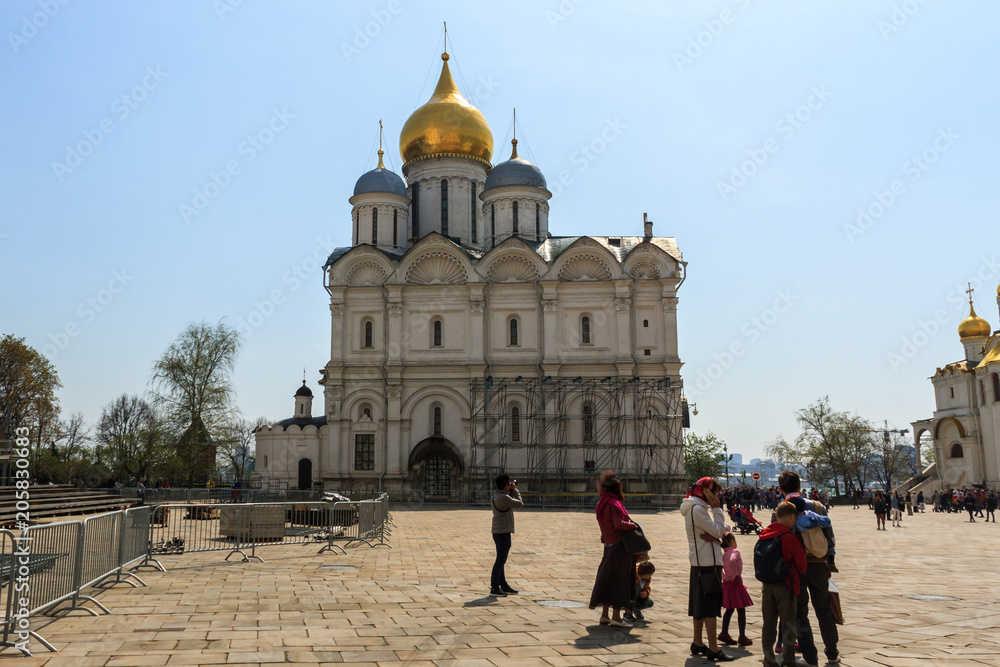 Tourists visit The Cathedral of the Archangel is the largest church in the Moscow.