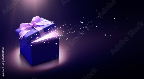 Blue open gift box with magical light photo