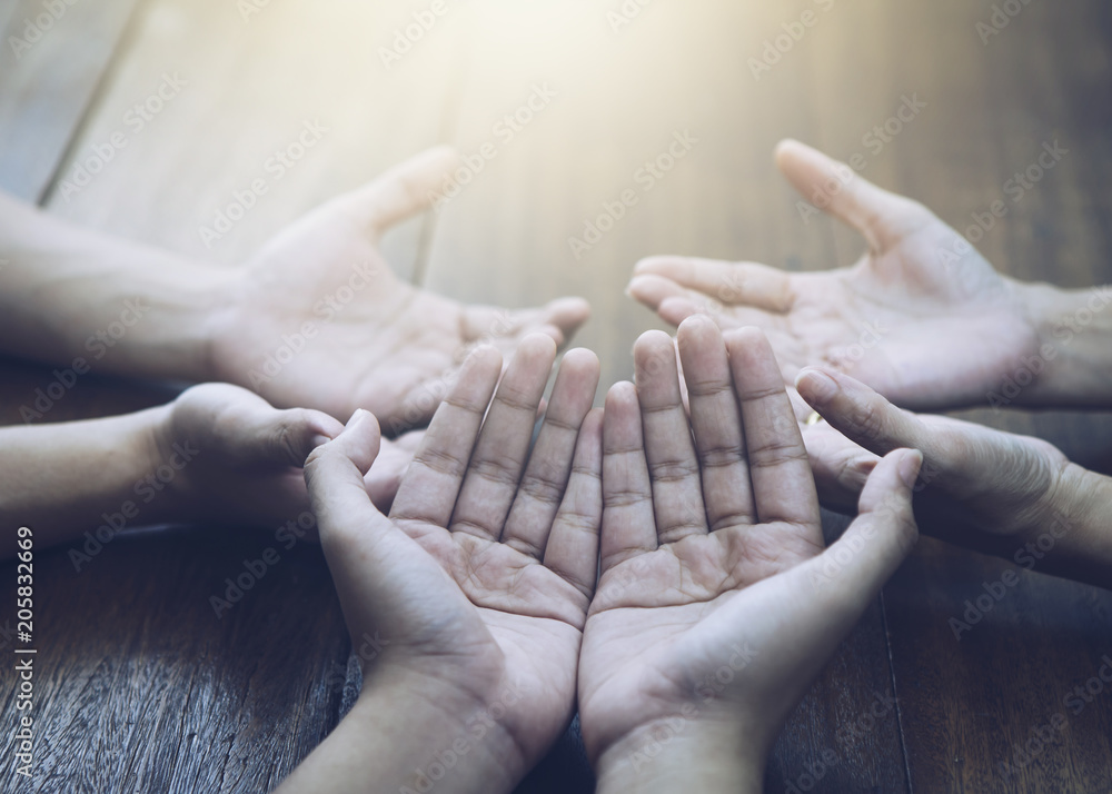 Christian bother and sister raise hands up and praying together around  wooden table ,small prayer group in church, christian background with copy  space for your text. Stock Photo | Adobe Stock