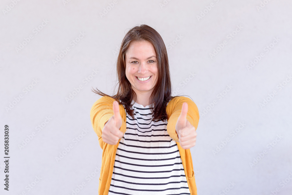 Enthusiastic motivated woman giving a thumbs up Enthusiastic motivated woman giving a thumbs up