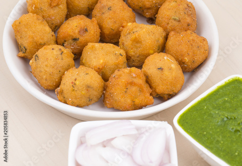 Indian Spicy Street Food Dal Vada Also Know as Moong Dal Vada, Pakoda, Pakode, Pakore, Moong Vada, Pakora or Bhajiya Served with Green Chutney or Onion