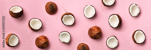 Fényképezés Pattern with ripe coconuts on pink background