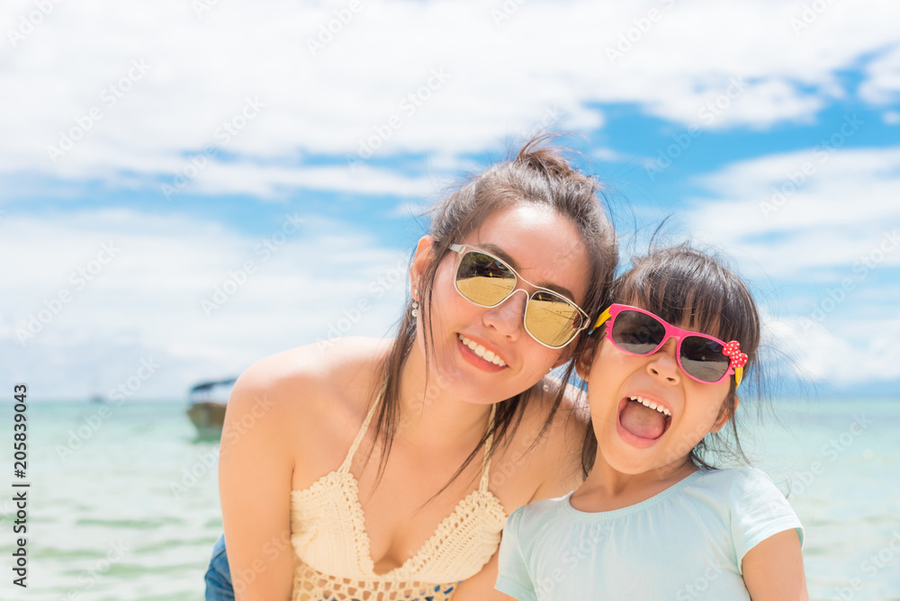 little girl and her mother have a good time at the seaside resort