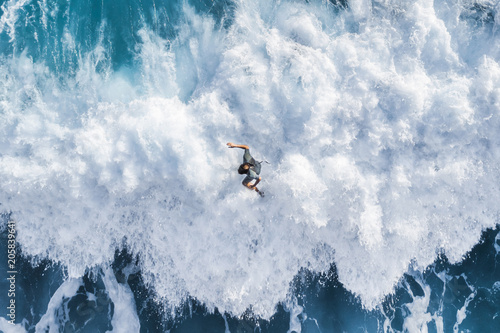 Photography Surfer on the crest of the wave, top view