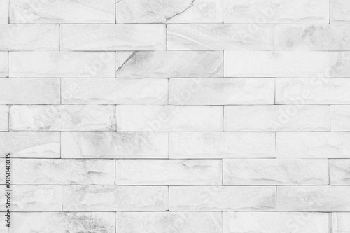 grey colors and white brick wall art concrete stone texture background in wallpaper limestone abstract paint to flooring and homework/Brickwork or stonework clean grid uneven interior rock old.