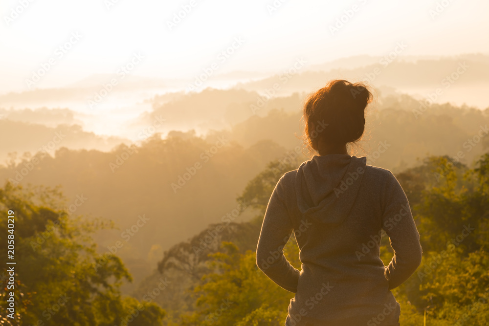 Obraz premium women Travel nature in the mountains,Woman watching the sunrise.