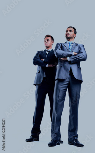 Two happy young businessmen full body, isolated on white.