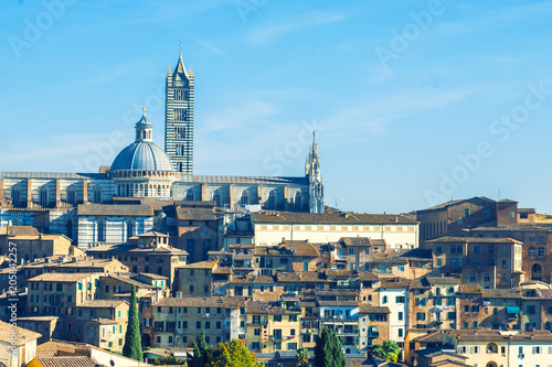 Beautiful medieval town in Tuscany, with view of the Dome & Bell Tower of Siena Cathedral (Duomo di Siena), landmark Mangia Tower and Basilica of San Domenico, Siena,Italy