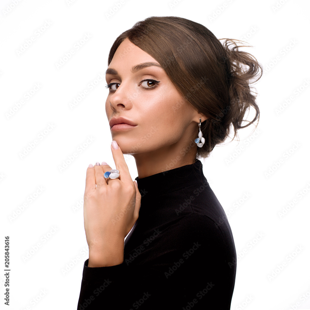 Beautiful, young brunette girl in black clothes with jewelry Beautiful, young brunette girl in black clothes with jewelry