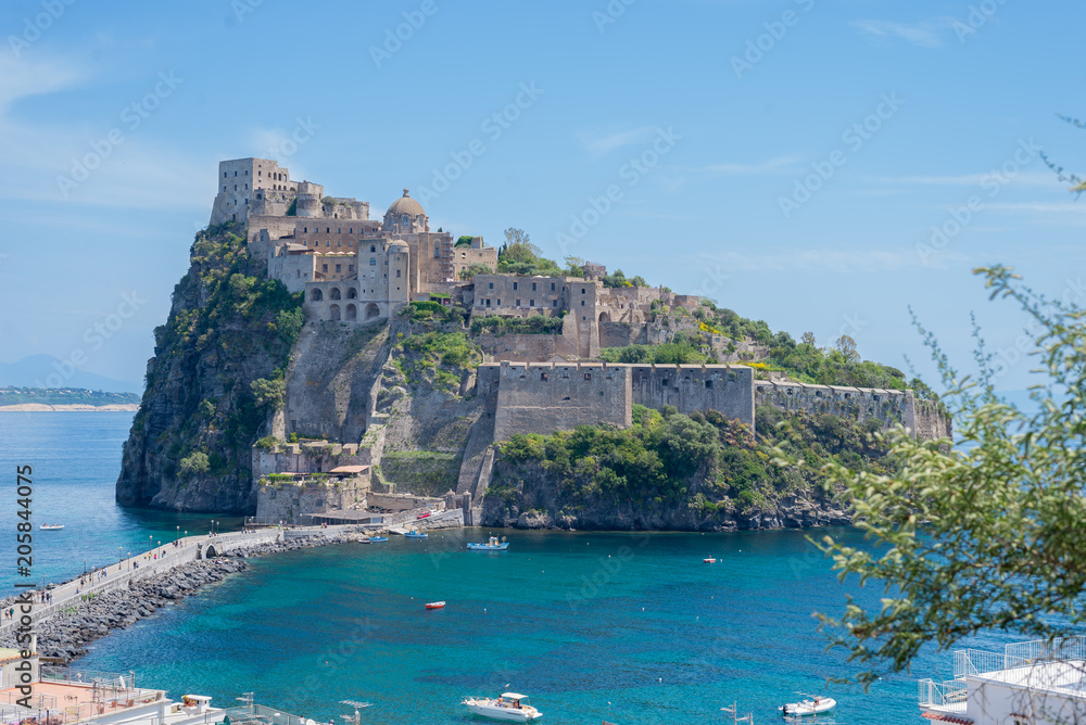 Ancient castle on the island in the blue sea