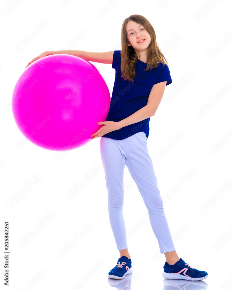 little girl is engaged in fitness with a ball. little girl is engaged in fitness with a ball.