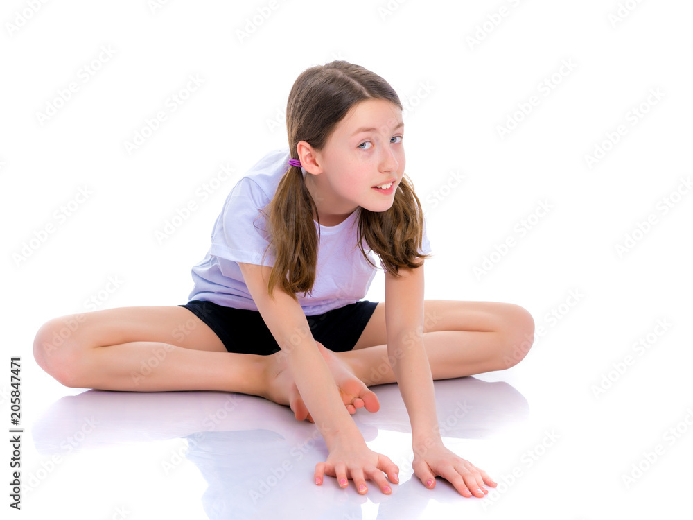 The gymnast perform an acrobatic element on the floor. The gymnast perform an acrobatic element on the floor.