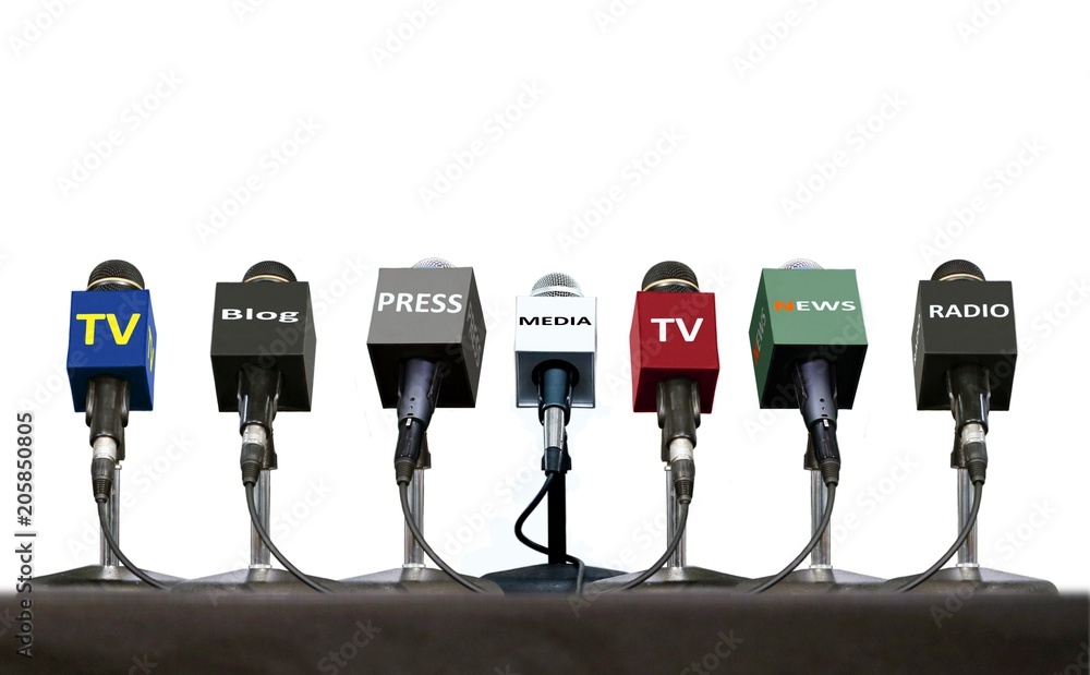 Press interview microphones on a table over white - obrazy, fototapety, plakaty 