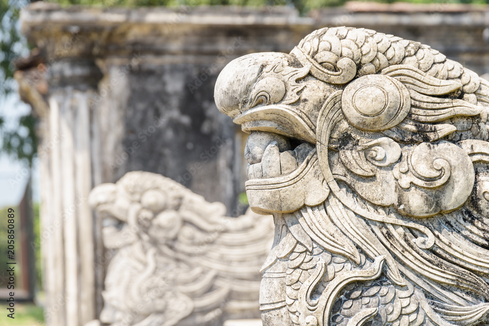 Closeup view of stone sculpture of dragon in Hue