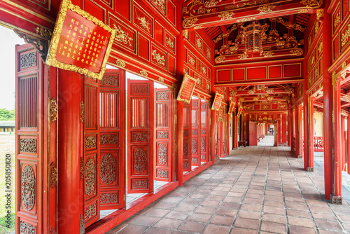 Red wooden hallway in the Purple Forbidden City, Hue, Vietnam