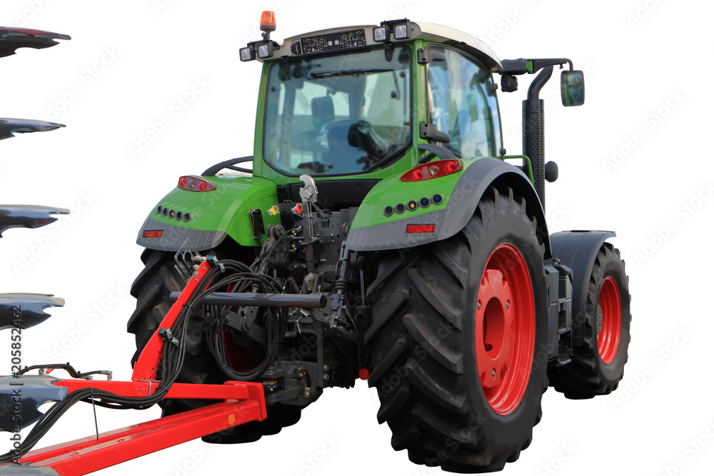 Tractor with attached plow in transport position. Tractor with attached plow in transport position.