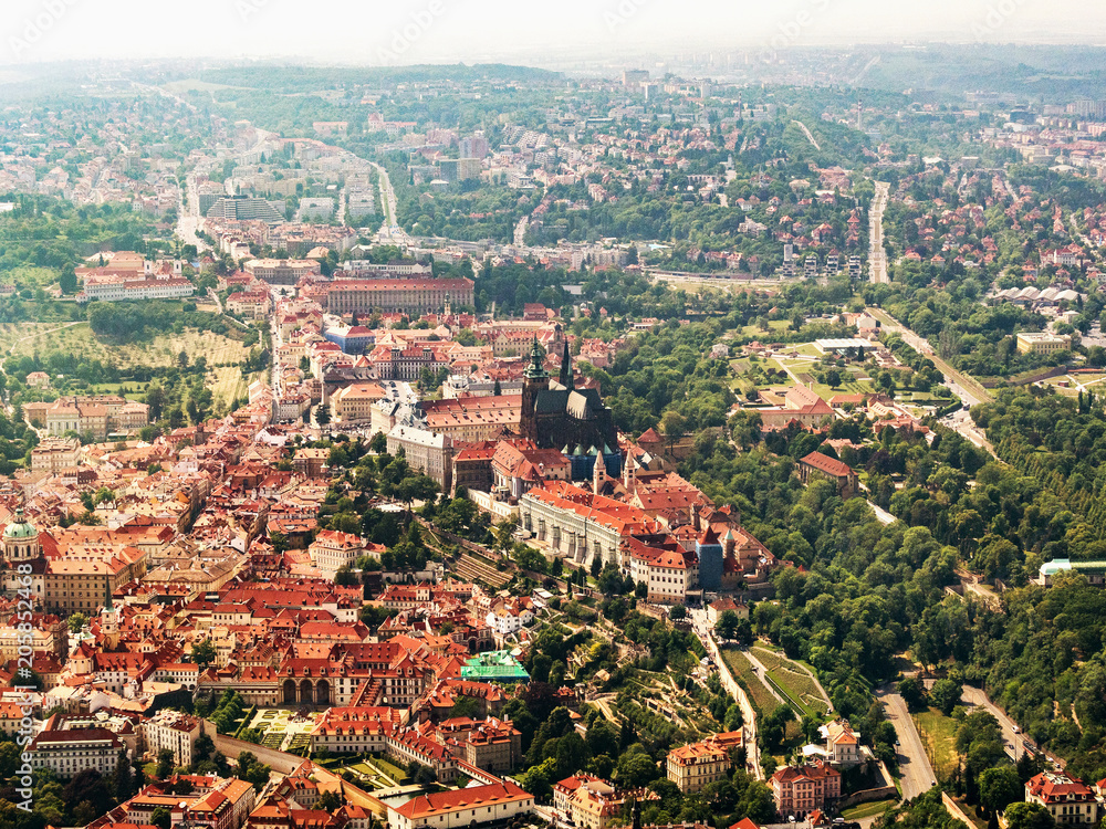 Aerial view on Prague Castle and Saint Vitus Cathedral, Czech Republic. Panoramic view from airplane.
