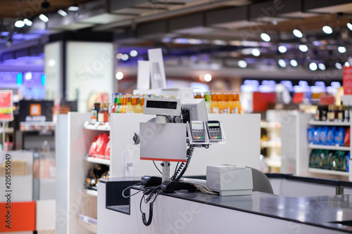 Slika na platnu Cash desk with card payment terminals on blurry background