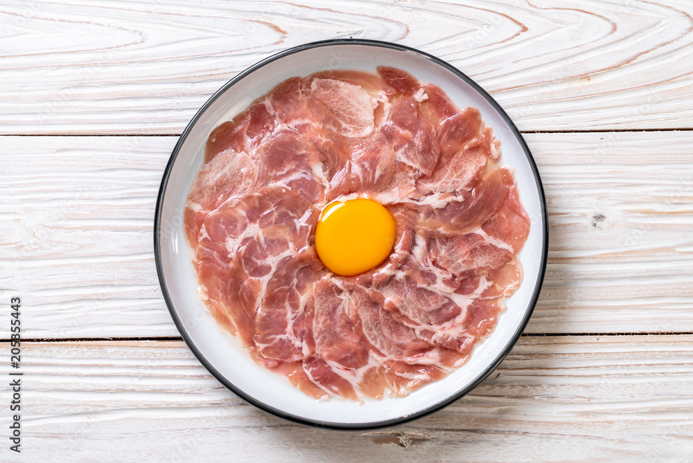 fresh sliced pork raw with egg fresh sliced pork raw with egg