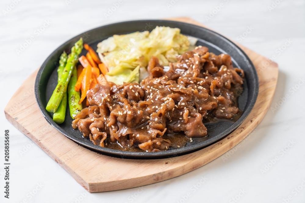 sliced pork steak on hot plate