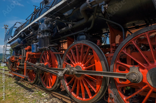 Steam locomotive with red wheels