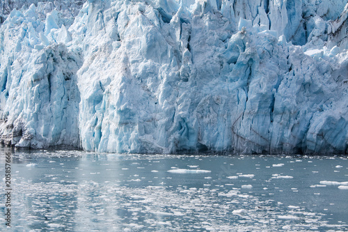 Alaska, USA: Close up of glacier with ice floes and reflections on the water