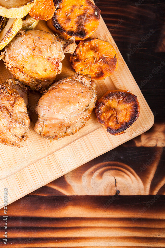 Top view of healthy and delicious dinner made of fried chicken and grilled vegetables