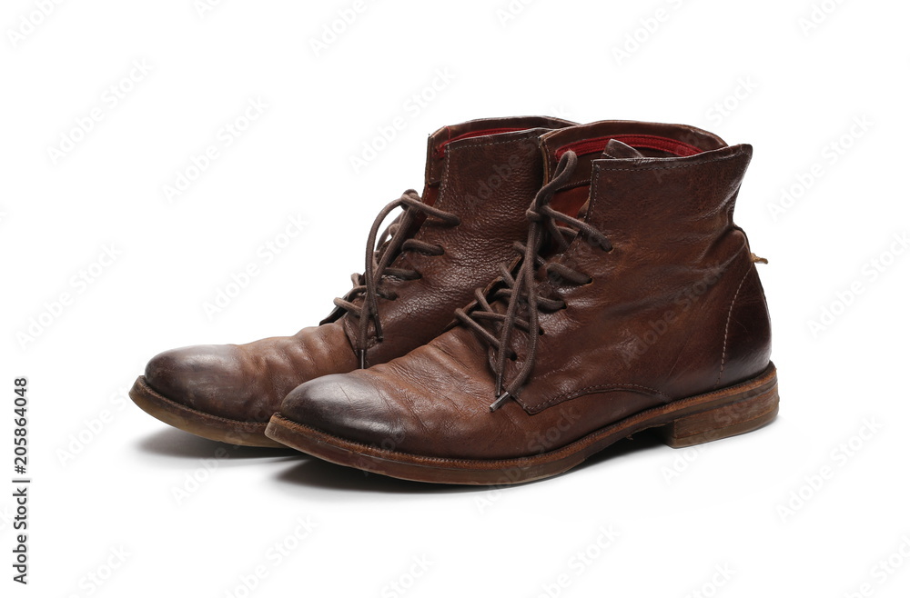 Old pair of brown shoes, isolated on white background Old pair of brown shoes, isolated on white background