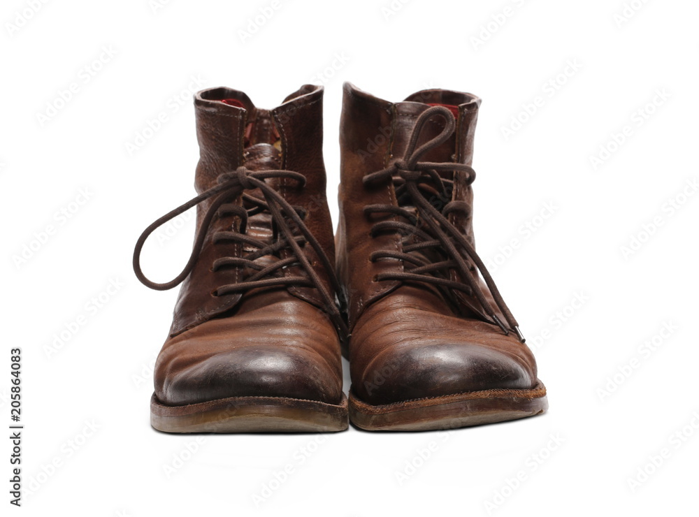 Old pair of brown shoes, isolated on white background Old pair of brown shoes, isolated on white background