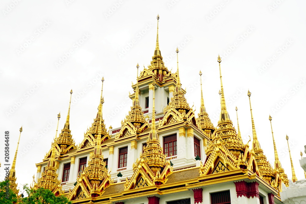 Naklejka premium Roof of Loha Prasat or golden metal castle in buddhism Wat Ratchanatdaram temple destination at Bangkok Thailand