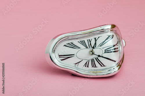 Clock with Distorted Soft Melting Design on Pink Background