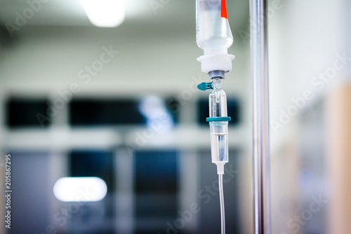 Intravenous therapy iv infusion set and bottle on a pole.