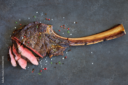 Tomahawk rib beef steak photo