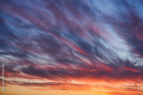 Fototapeta Naklejka Na Ścianę i Meble -  Dramatic sunset sky with clouds. Bright blue and orange sky