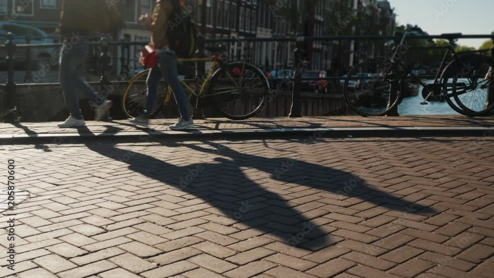 Bicycle traffic on the narrow bridge in Amsterdam Bicycle traffic on the narrow bridge in Amsterdam